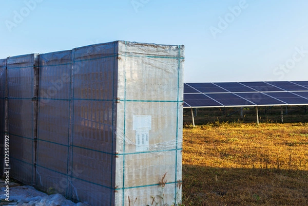 Fototapeta Solar panel boxes prepared for installation in power generation areas