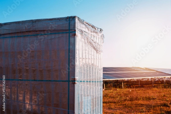 Fototapeta Solar panel boxes prepared for installation in power generation areas