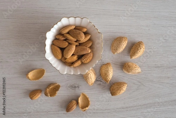 Fototapeta nuts and nutcracker on wooden table