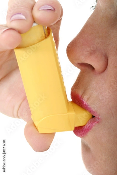 Obraz woman using asthma inhaler
