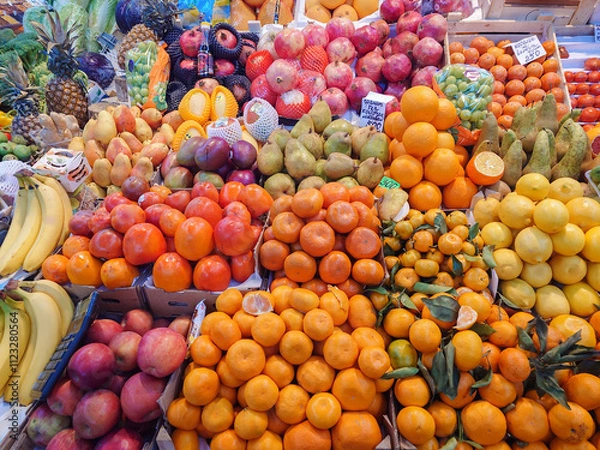 Fototapeta Various vegetables and fruits on the counter of the food market.
