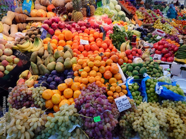 Fototapeta Various vegetables and fruits on the counter of the food market.