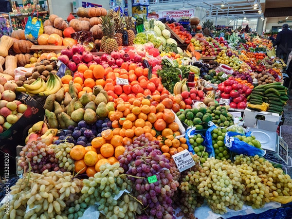 Fototapeta Various vegetables and fruits on the counter of the food market.