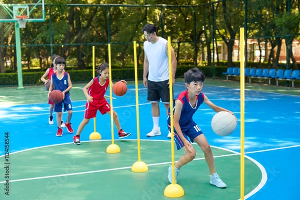 Obraz Chinese Kids Warming Up During Basketball Training Class