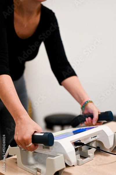 Fototapeta Nutritionist holding measurement device handles in clinic