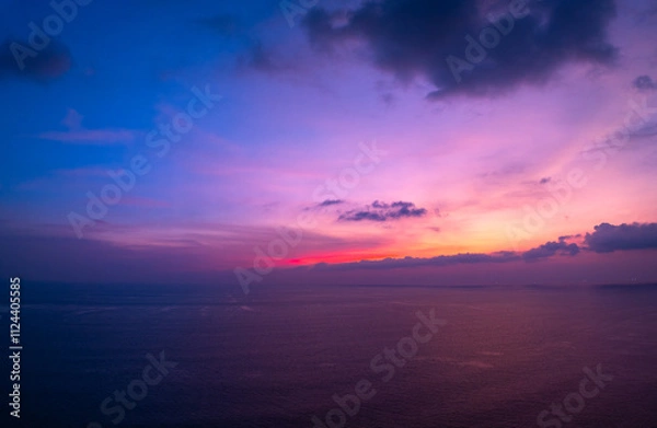 Fototapeta Aerial view sunset sky,Nature beautiful Light Sunset or sunrise over sea,Colorful scenery Sky with Amazing clouds and waves in sunset sky purple light cloud background