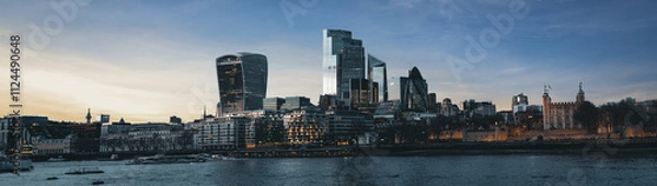 Fototapeta London skyline showing modern buildings at dusk with tower of london