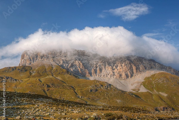 Fototapeta High mountain range. There are beautiful clouds above the mountains.