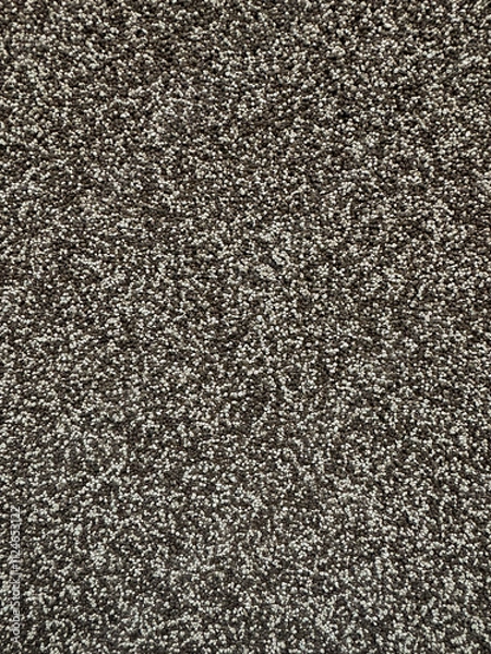 Fototapeta Close up texture of pebbles, small grey, white stone. Abstract colored background of natural material closeup. Light gray stone wall wide texture. 