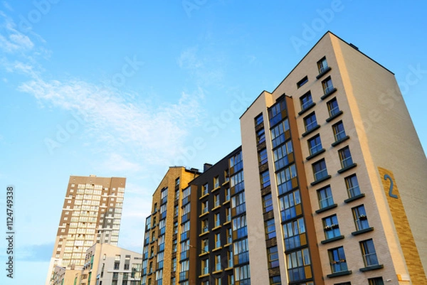 Fototapeta Residential condominium building. Modern complex of Apartment residential condo. Residential architecture exterior. Modern facade building. New House, Eco-friendly residential building.