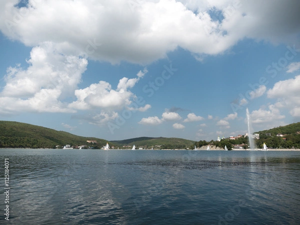 Fototapeta Abrau Durso, Russia 28 August 2024: Panoramic view of the lake Abrau-Durso with sailboats on a sunny day