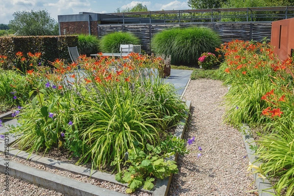 Fototapeta Beautiful garden idea in model gardens Appeltern, The Netherlands