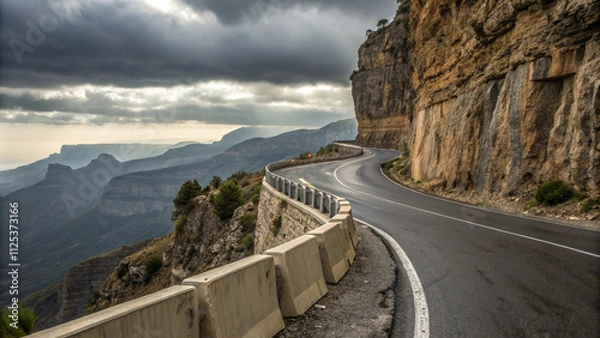 Obraz Winding Mountain Road with Dramatic Cloudscape