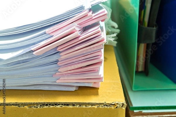 Obraz Close up of business documents stack on desk , report papers stack