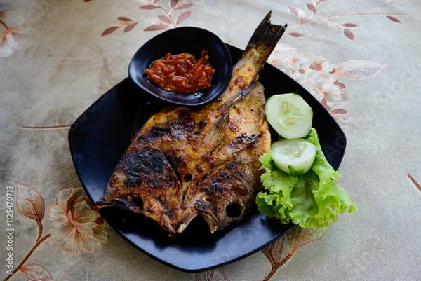 Obraz Ikan Bakar Indonesian Grilled Fish Glazed with Kecap Manis Sweet Soy Sauce and Served with Sambal Olek Chili Sauce