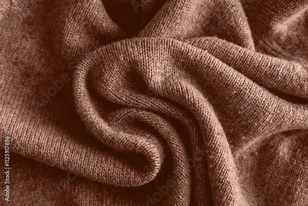Fototapeta Mocha Mousse Background. Top view of soft warm textile texture with swirl of waves. Trendy color of year 2025 - Mocha Mousse. Abstract Background Textile