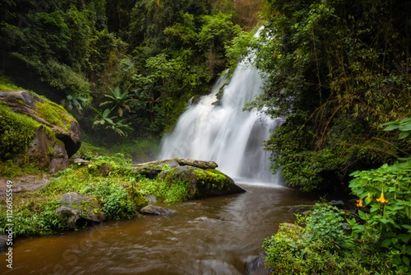 Fototapeta Pha Dok Siew waterfall and trail through dry rainforest with incredible close-up waterfall views and terraced rice, Ban Mae Klang Luang, Doi Inthanon National Park, Chom Thong, Chiang Mai Thailand