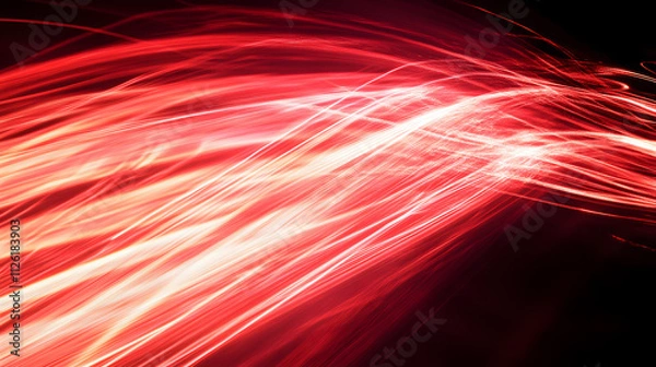 Fototapeta Bright red light trails creating an abstract pattern in a dark background during a night event