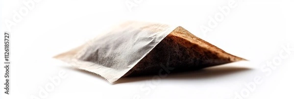 Fototapeta Tea bag a simple label and string isolated against a bright white backdrop
