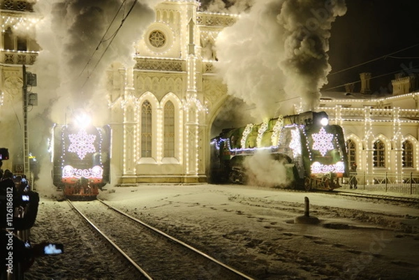Fototapeta Christmas train with steam locomotive and illumination