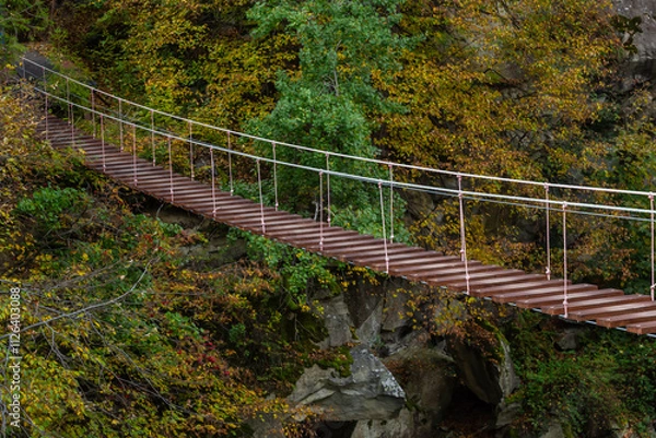 Fototapeta Suspension bridge, walkway to the adventurous, cross to the other side
