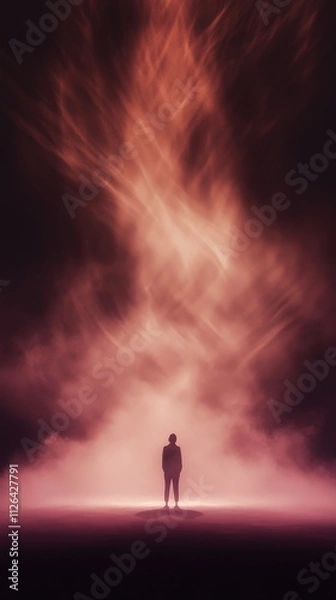 Obraz A solitary figure stands in a mystical haze, illuminated by vibrant light, evoking a sense of wonder and introspection in an ethereal atmosphere.