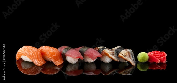 Fototapeta Sushi nigiri set over black background
