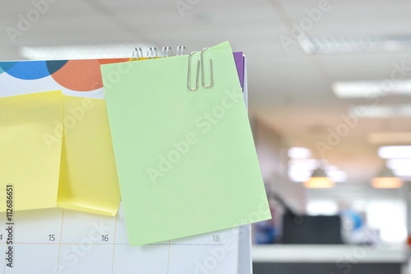 Fototapeta Post-it notes on calendar at workplace with copy space for text