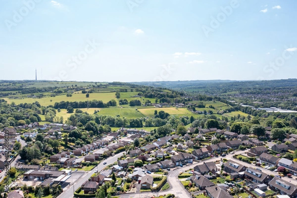 Fototapeta Aerial drone photo of the village of Kirkheaton, Huddersfield in the Kirklees district in the county of West Yorkshire England showing the village and River Calder from above in the summer time.