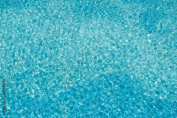 Fototapeta repeatable water light reflections photo pattern on the ground of a pool, with scattered little sunbeams