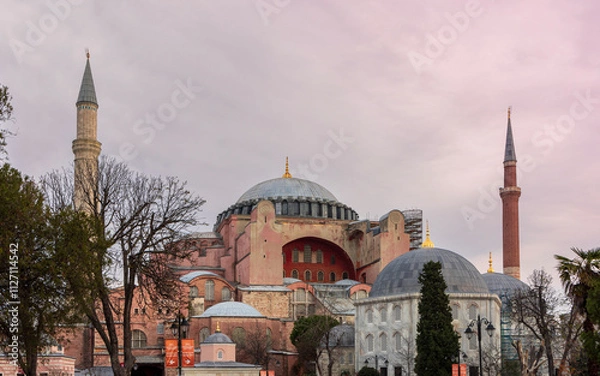 Fototapeta The iconic Hagia Sophia in Istanbul, Turkey, captured on a cloudy day, showcasing its historic architecture, domes, and minarets as a symbol of cultural heritage.