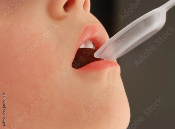 Obraz Child is taking a medicine