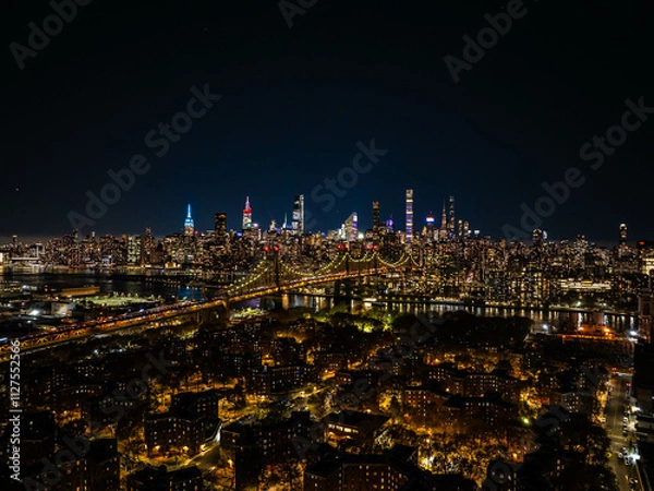 Obraz Illuminated Queensboro Bridge connecting Manhattan and Queens, part of the stunning New York City skyline glowing at night