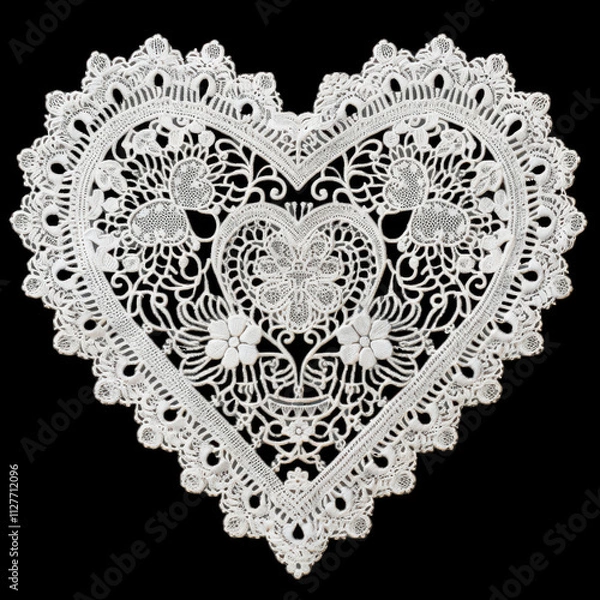 Fototapeta delicate lace heart doily featuring intricate floral patterns, perfect for decoration or as romantic gift. Its elegant design adds charm to any setting