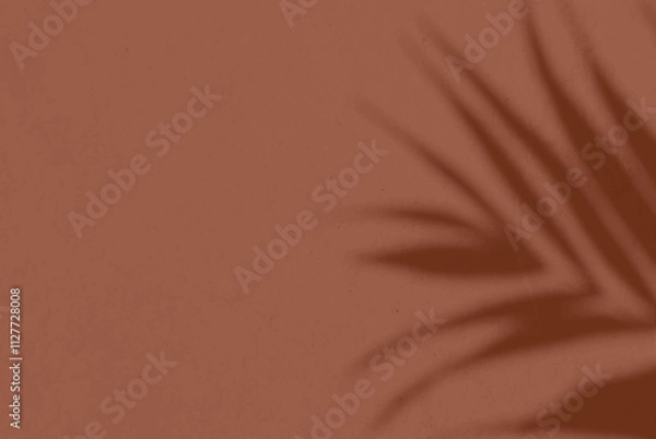 Fototapeta Shadow leaf dypsis on Mocha Mousse color wall. Mocha mousse color of the year 2025. Monochrome background.
