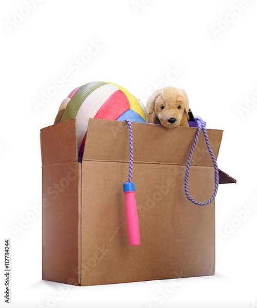 Fototapeta Box of used toys for a removal, garage sale, auction, or donation to a charitable organization. Isolated on white background.