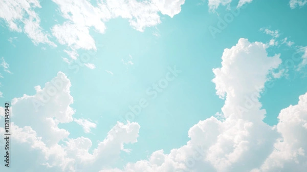 Fototapeta Beautiful Cloudy Sky Over Turquoise Background with Fluffy White Clouds Creating a Serene and Dreamy Atmosphere for Relaxation and Inspiration