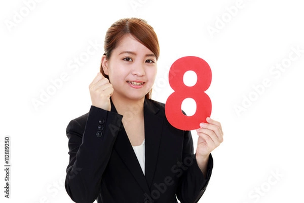 Obraz 数字を持つ笑顔のビジネスウーマン