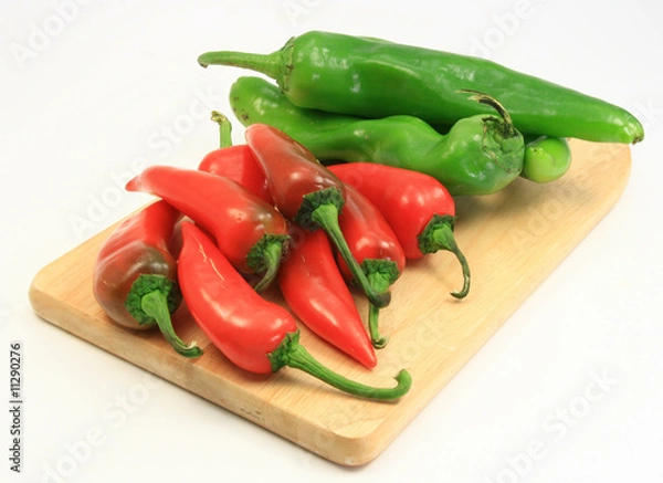 Obraz Red and Green chile angle view on cutting board