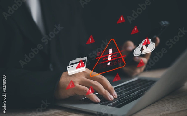 Fototapeta businessman works on a laptop surrounded by red warning icons, symbolizing cybersecurity threats, data security issues, and the urgent need for protection against digital vulnerabilities and breaches.