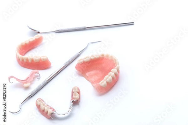 Obraz Set of dentures and dental tools on white background