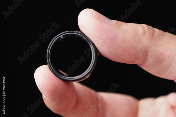 Fototapeta Black Tracker Smart Ring, Step Counter, Heart Rate, Blood Oxygen Tracker, Health Ring. Close-up. 