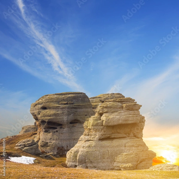 Fototapeta closeup rocky cliff  at the dramatic sunset