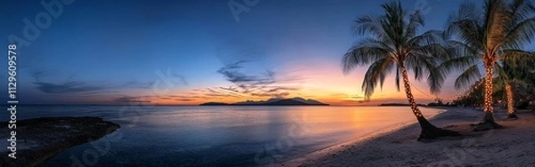 Obraz Palm Trees with Christmas Lights Against a Tropical Sunset