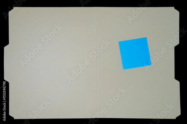 Obraz manila file folder with sticky note on black background