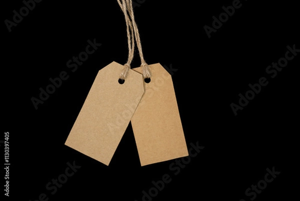 Obraz 2 blank tags with twine on black background