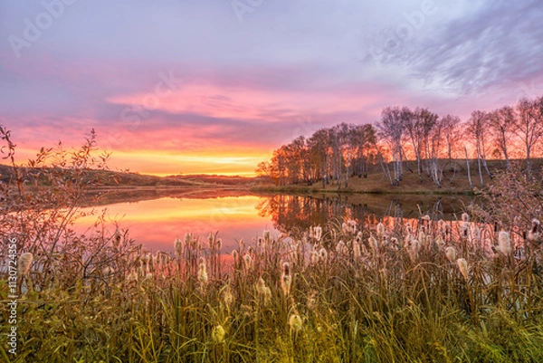 Fototapeta Colorful dawn in the village of Osinovka on the lake shore in the Kurgan region of Russia