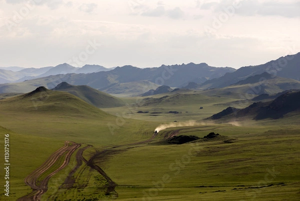 Fototapeta 4x4 car moving fast by a dirt road in Mongolia in summer