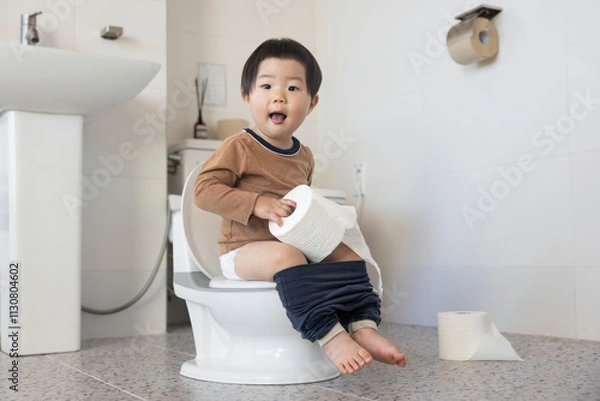 Obraz 화장실에서 어린이 변기로 배변 교육중인 어린이