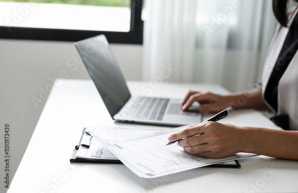 Fototapeta Business woman employer holding resume hiring recruit looking cv resume to hire candidates, analyzing information before job interview. Recruitment concepts